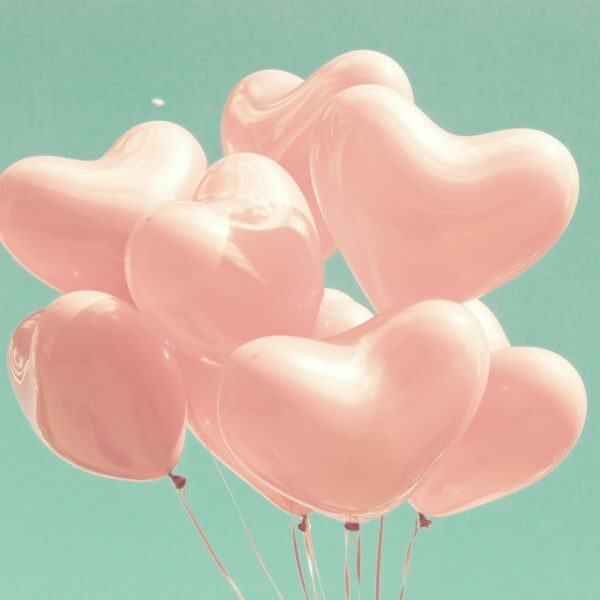 Bunch of pink heart-shaped balloons
